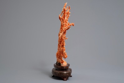 A Chinese carved red coral 'blossom tree' group on inlaid wooden stand, 19/20th C.